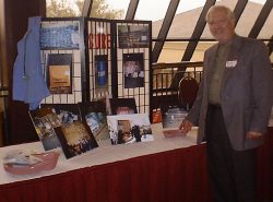 Dr. Fisher with display in Dallas - 8 Jan 2000